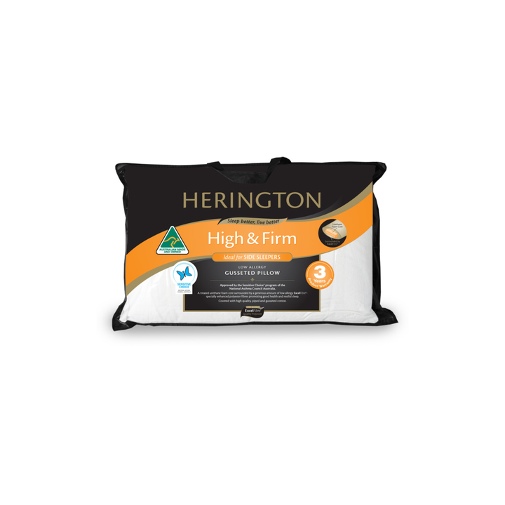 A Herington High & Firm mattress topper in its retail packaging, featuring a black and white design with a prominent orange accent stripe.